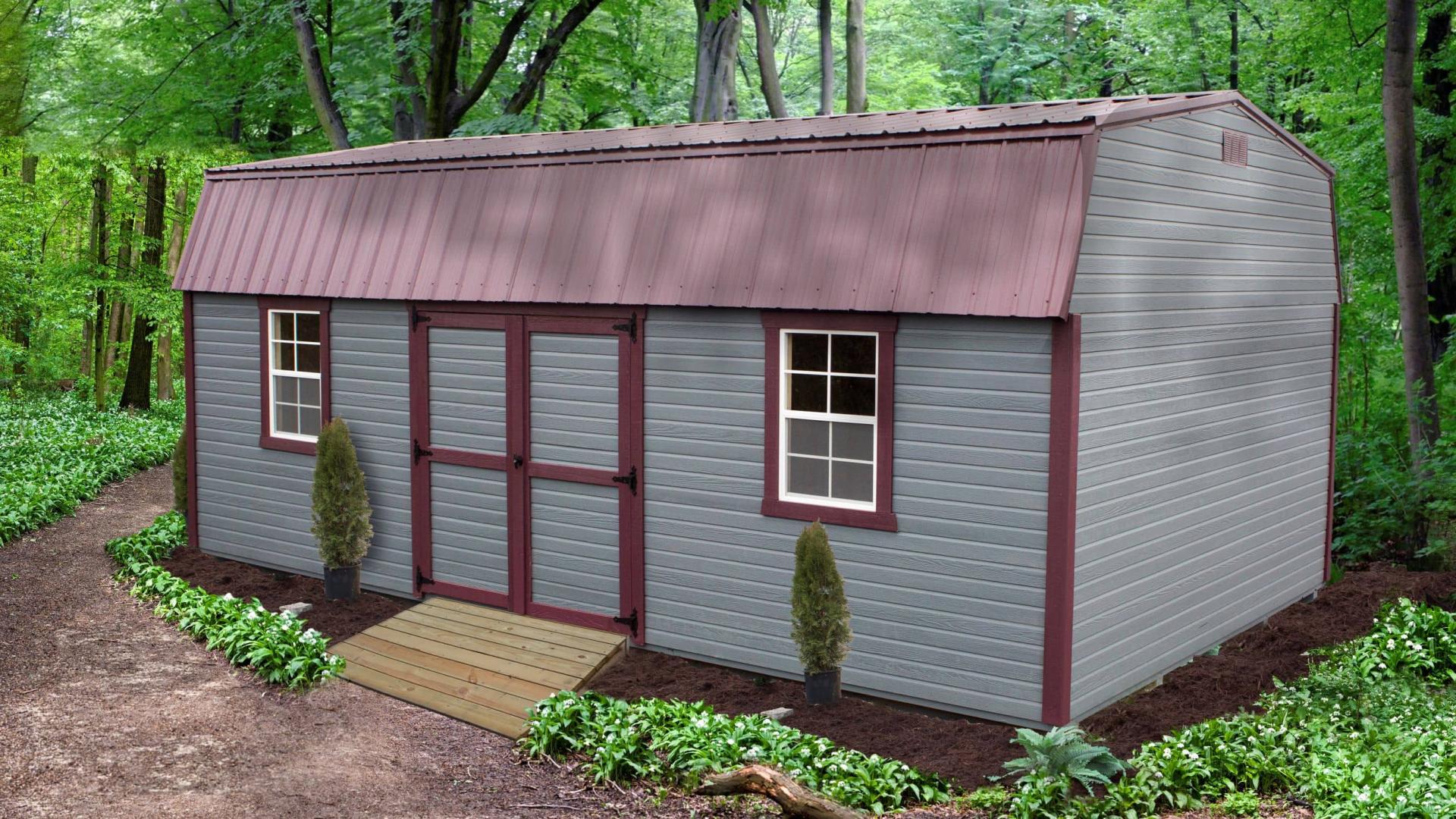 Gray high barn with burgundy trim