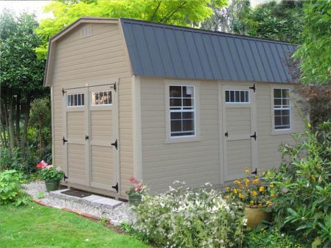 Light tan Signature High Barn with light tan trim, double doors, windows, and a gray roof.